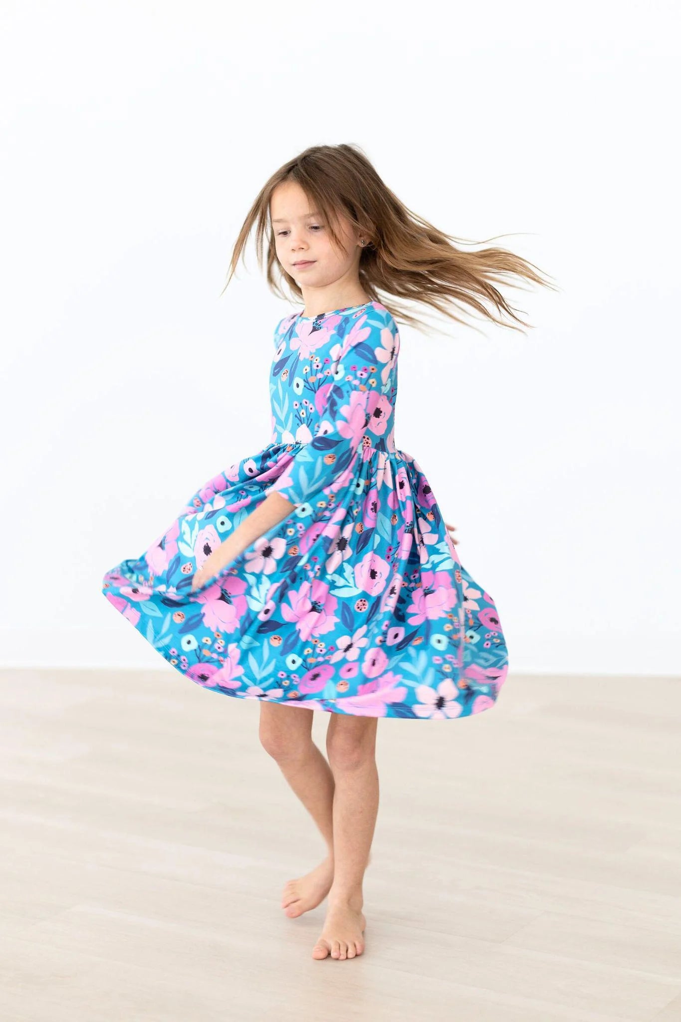 Mila & Rose Twirling in Teal Dress