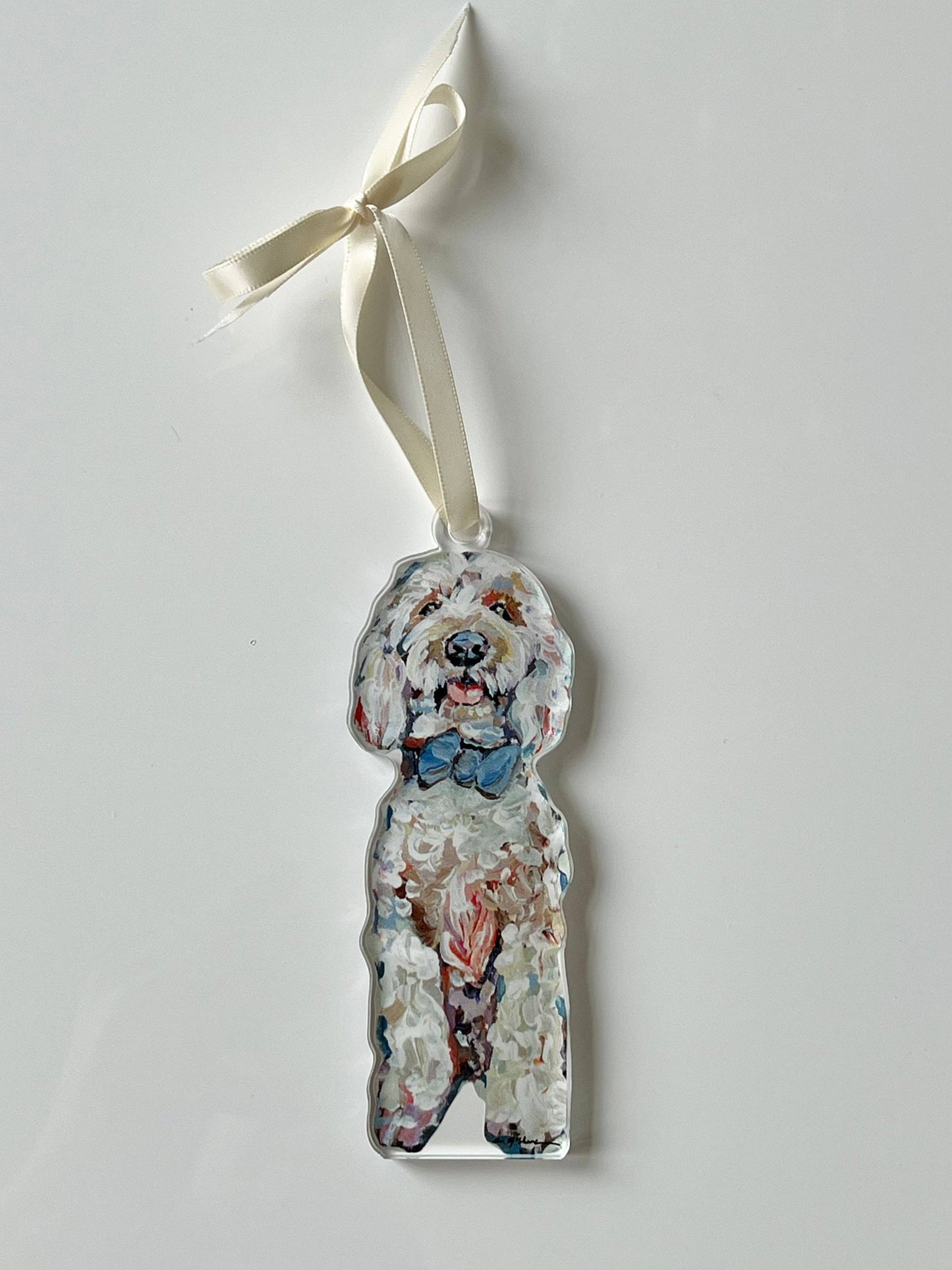 Goldendoodle with blue bow Ornament