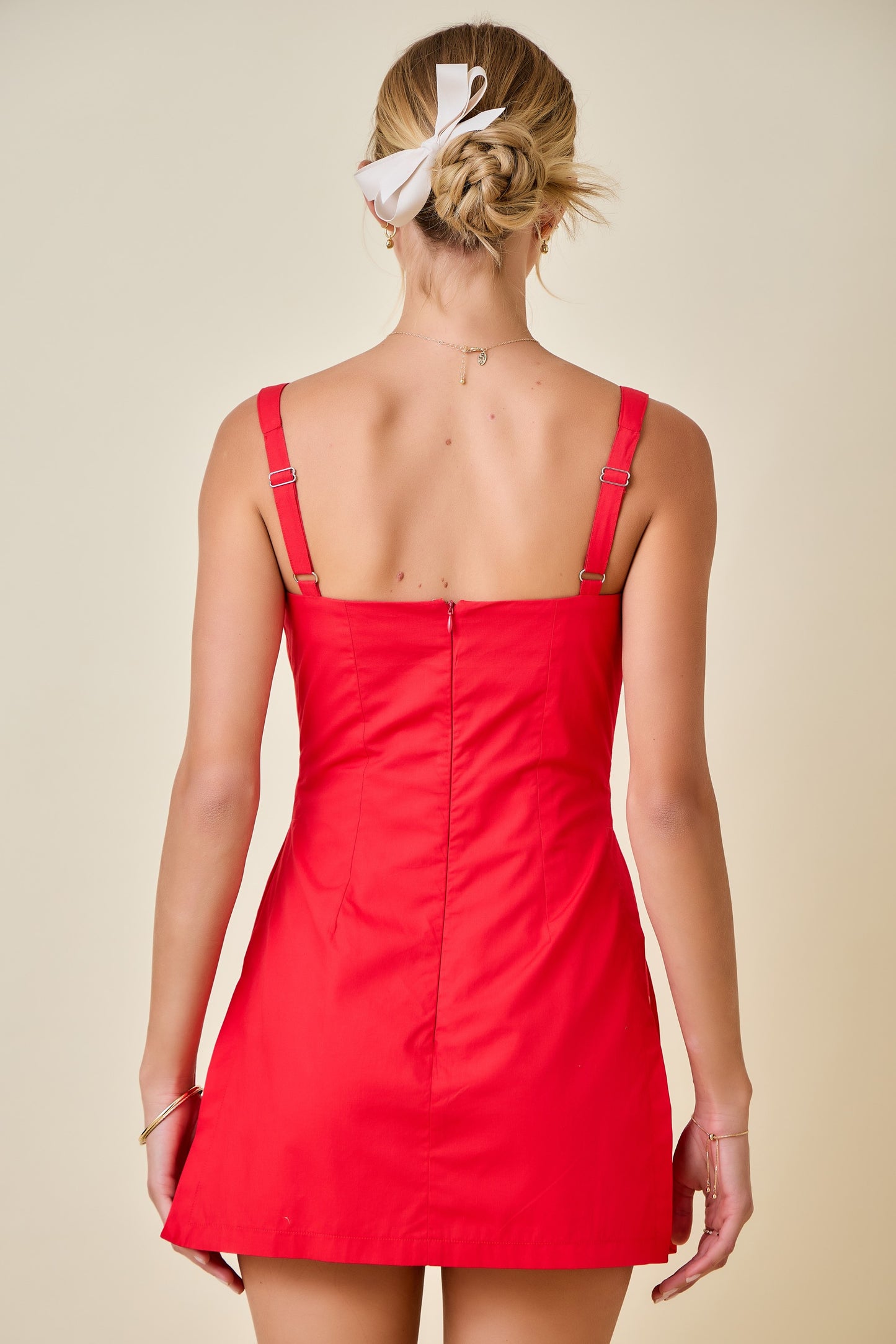 Sleeveless Front Twist Poplin Romper Dress with Overlay Skirt in Red